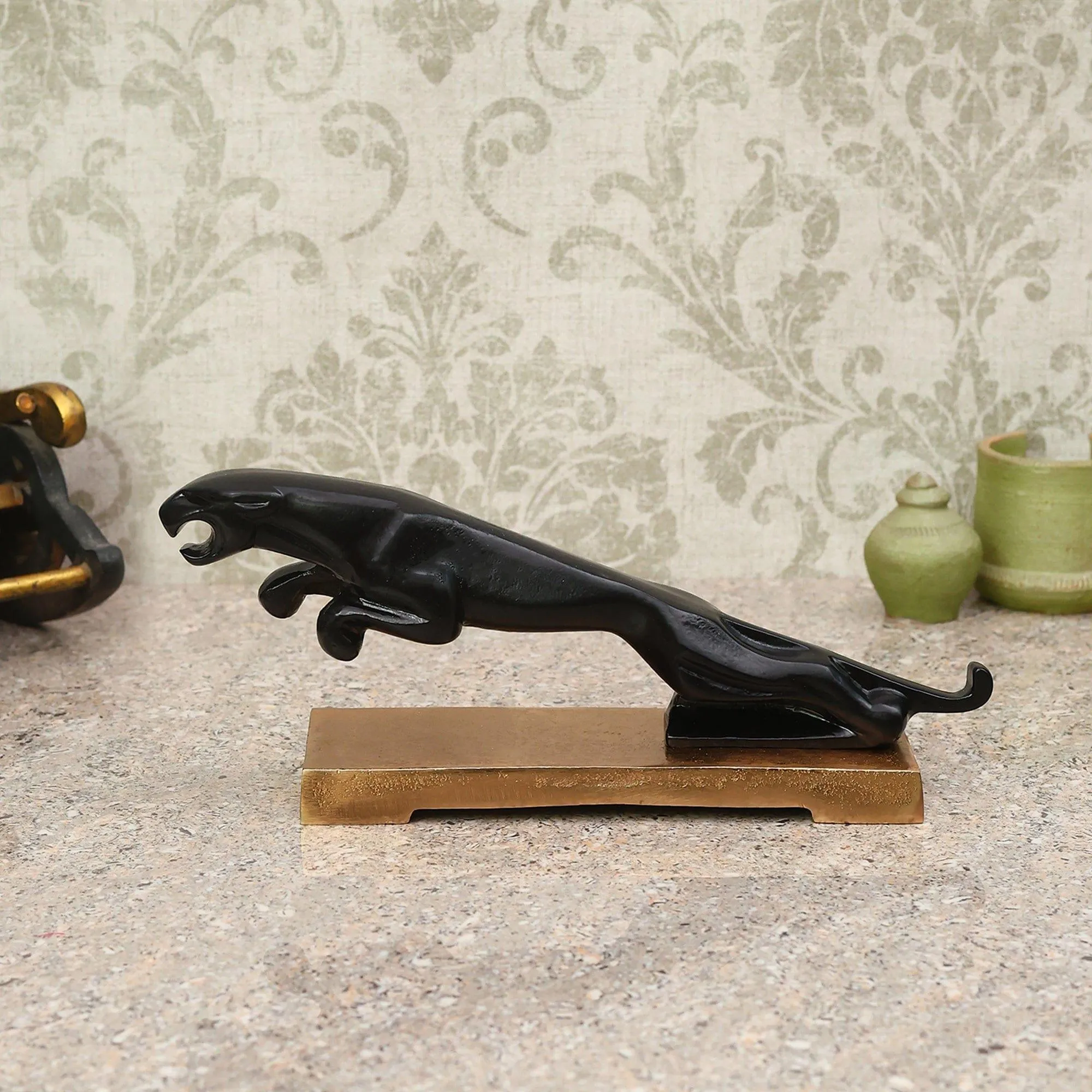 The panther's leap on gold base