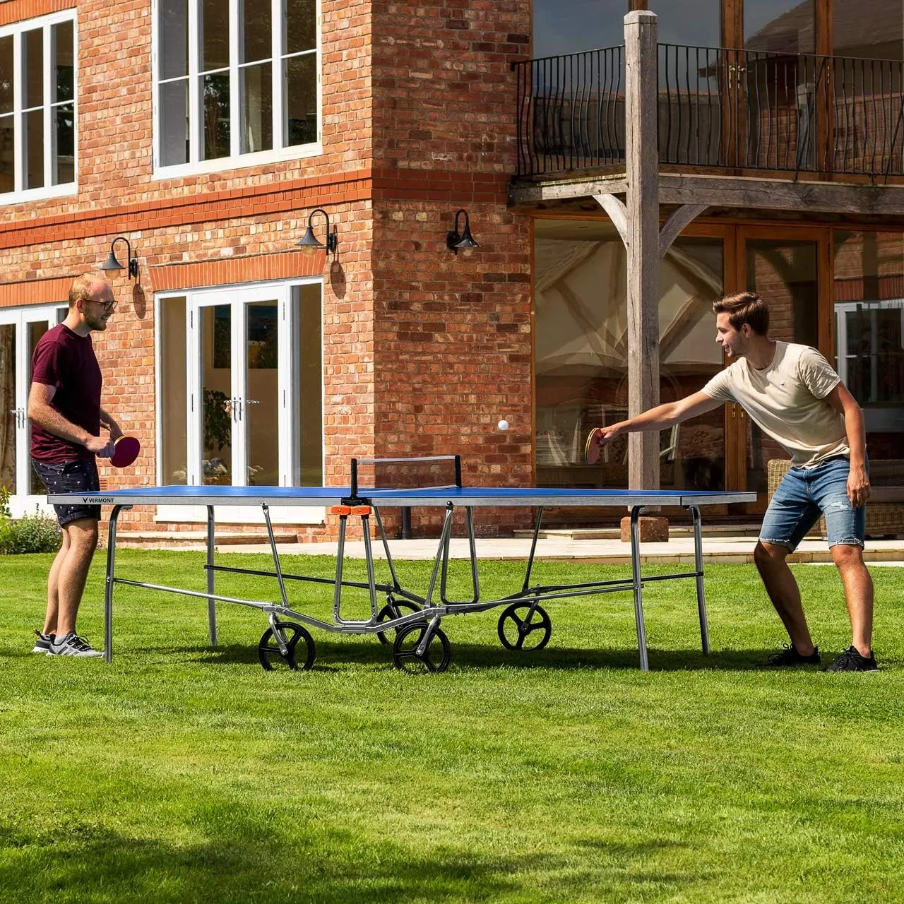 Vermont TS100 Outdoor Table Tennis Table | Portable Regulation-Size Ping Pong Table with Steel Frame & 360° Wheels | Optional Bat & Ball Sets for All Skill Levels